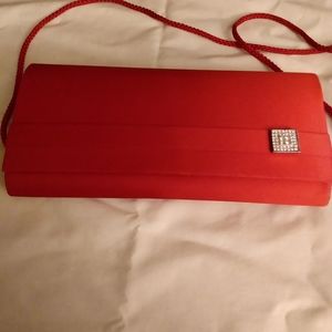 Red satin clutch handbag